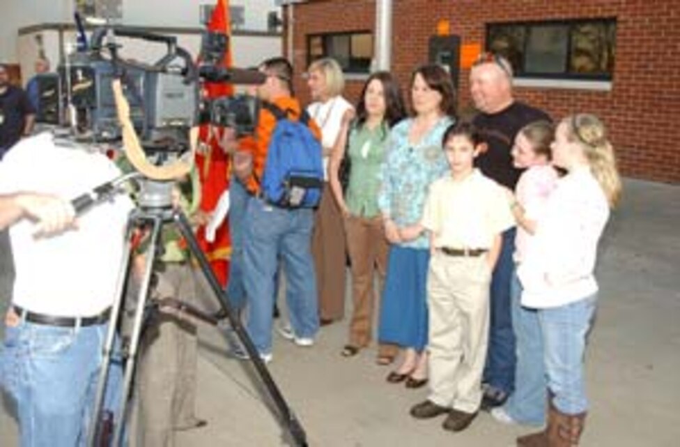 IED Roller team member Wilt Jones, his wife Jessica and their four children are interviewed by WALB-TV Channel 10 after Jones? return from Iraq Feb. 22.