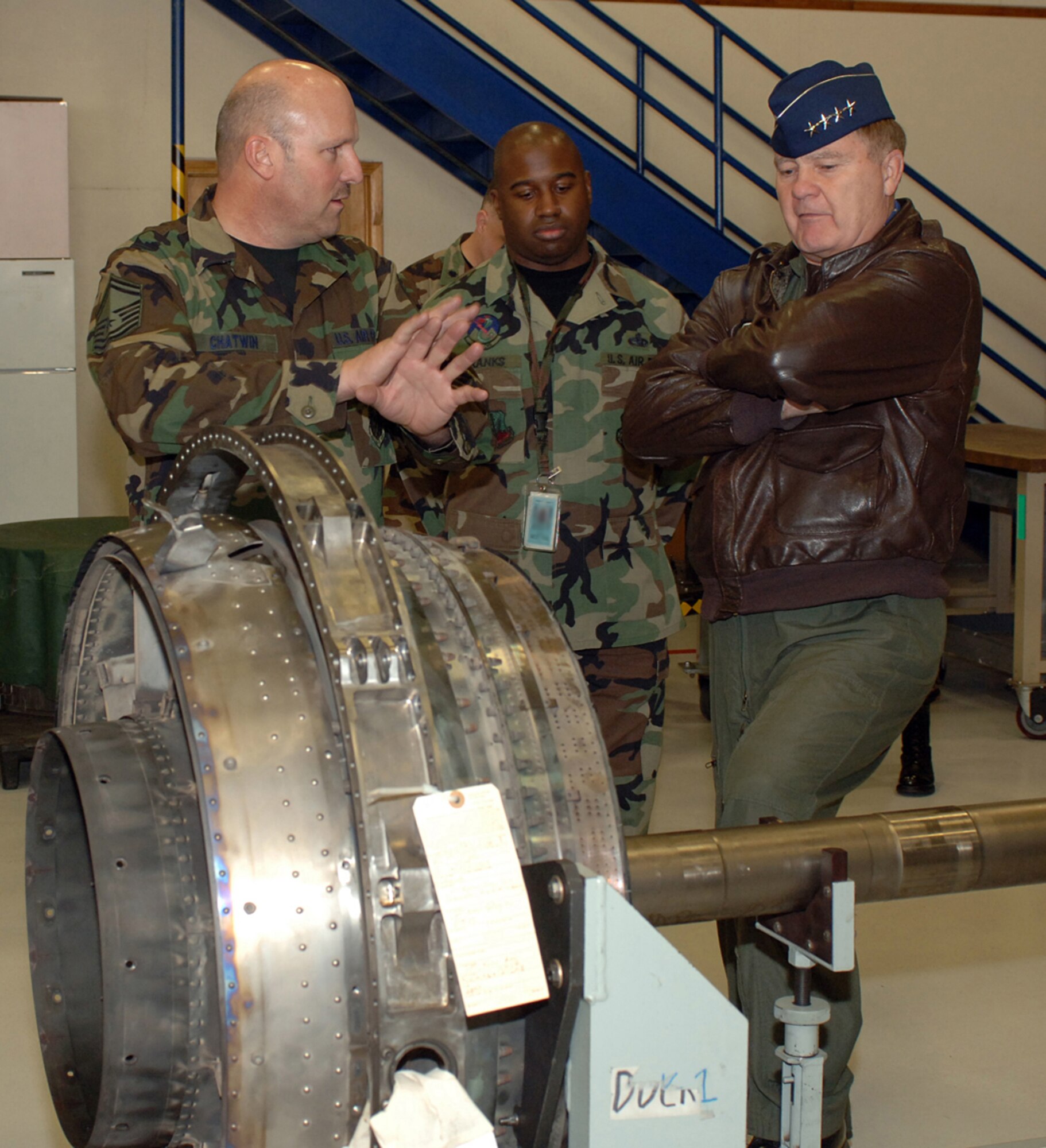 Senior Master Sgt. David Chatwin, 419th Maintenance Squadron Propulsion Flight chief, discusses components of the F-16 engine with Gen. Ronald E. Keys, commander of Air Combat Command.  The Reserve 419th Fighter Wing and active duty 388th Fighter Wing Propulsion Flights began working together as a part of Total Force Integration in February 2006.   
