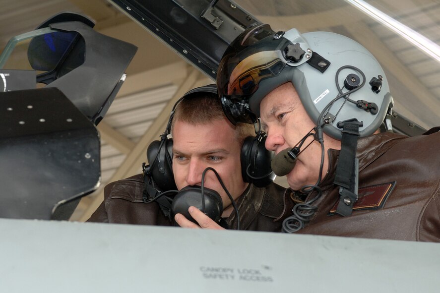 Photo by Alex Lloyd
Capt. Bart Wilbanks, 34th Fighter Squadron pilot, shows Gen. Ronald E. Keys, commander of Air Combat Command, Link 16 capabilities that are part of the ongoing F-16 ongoing Common Configuration Implementation Program upgrades here.  General Keys visited the 388th Fighter Wing Jan. 9-11.  