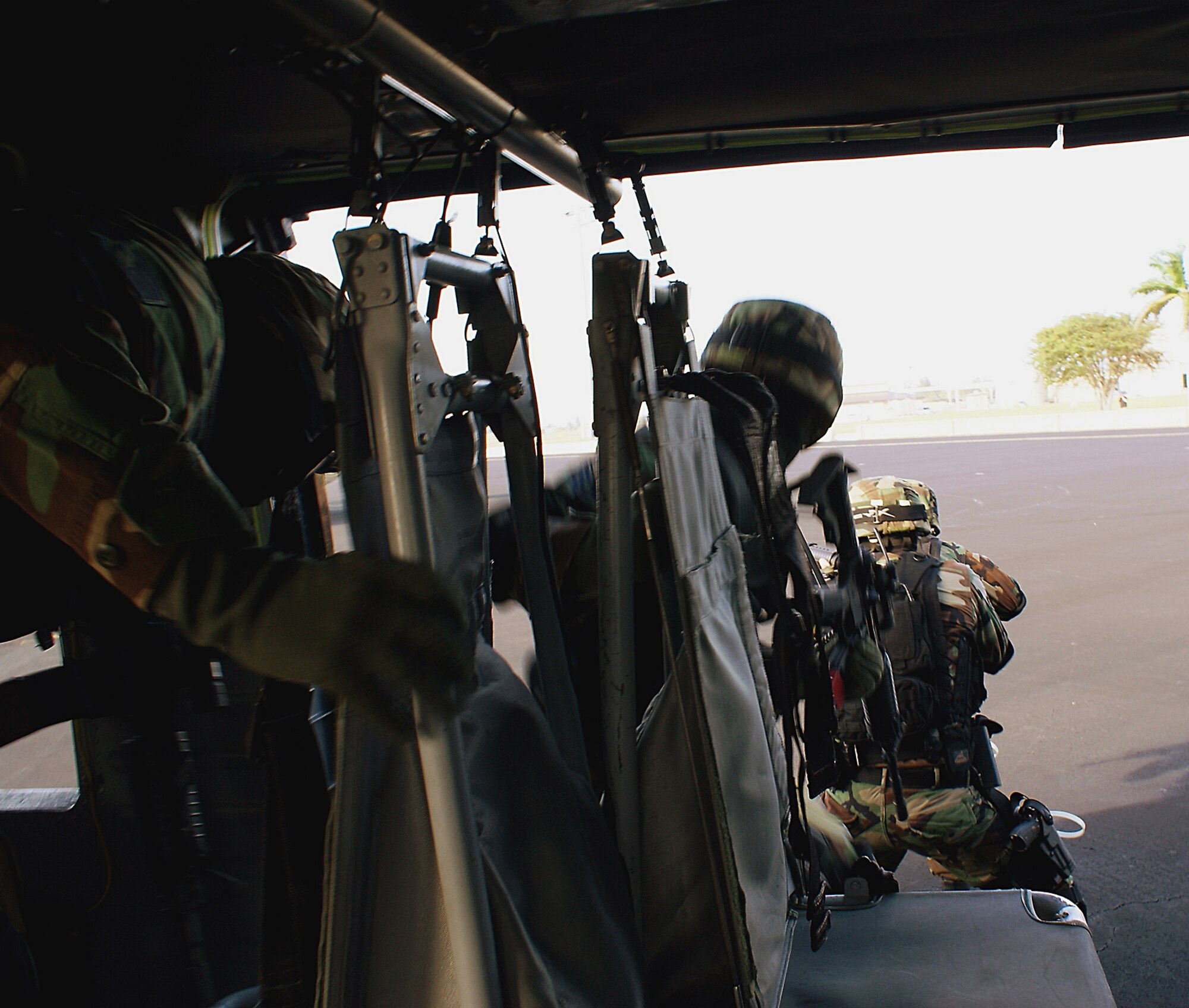 Members of the Homestead Air Reserve Base Special Response Team dismount a UH-60 Blackhawk helicopter to approach a diverted airplane during a training exercise here at Homestead ARB, Fla. SRT members train for various missions ranging from hostage situations to escorting dignitaries. (U.S. Air Force photo/Ryan Ayers)