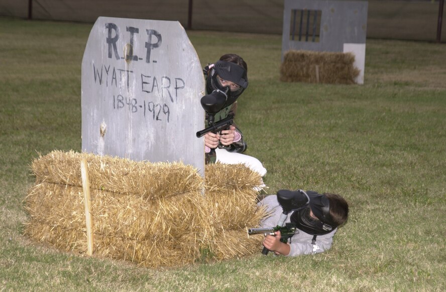 (Photo by A1C Jennifer Jackson) Two paintballers practice for a tournament Saturday. The tournament is part of Vance Air Force Base’s grand opening of the paintball field.