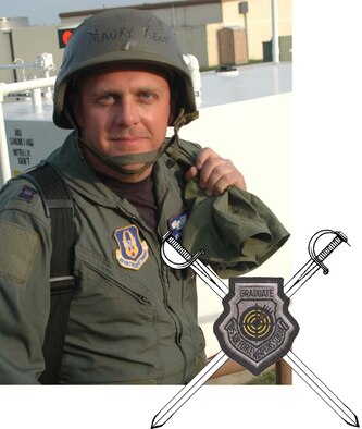 Capt. Maury Kent, 93rd Bomb Squadron B-52 instructor aircraft commander, stops to pose for a photo during the joint 2nd Bomb Wing and 917th Wing conventional operational readiness exercise March 8, 2006. Insert: the Air Force Weapons School patch laid across two swords. (U.S. Air Force photo illustration/Tech. Sgt. Sherri Savant)