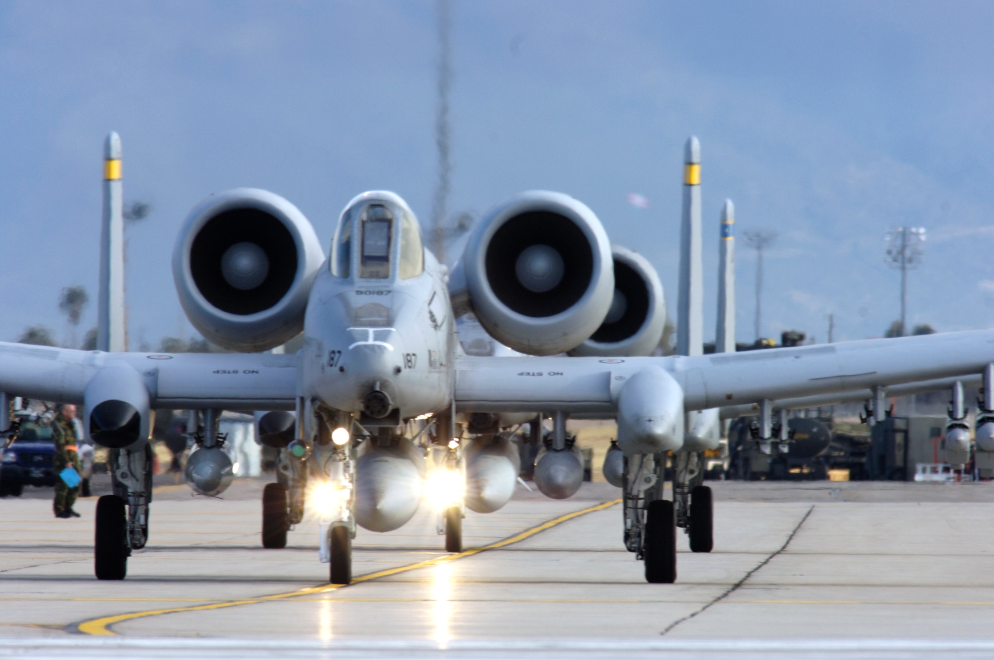 Pilots from the 354th Fighter Squadron taxi down the tarmac preparing to take off in their A-10 Thunderbolt IIs to a simulated deployed location as a part of Bushwhacker 07-02 Jan. 21at Davis-Monthan Air Force Base, Ariz. Bushwacker 07-02 is an operational readiness exercise that tests the 355th Wing's ability to prepare deploy. (U.S. Air Force photo/Senior Airman Jesse Shipps)