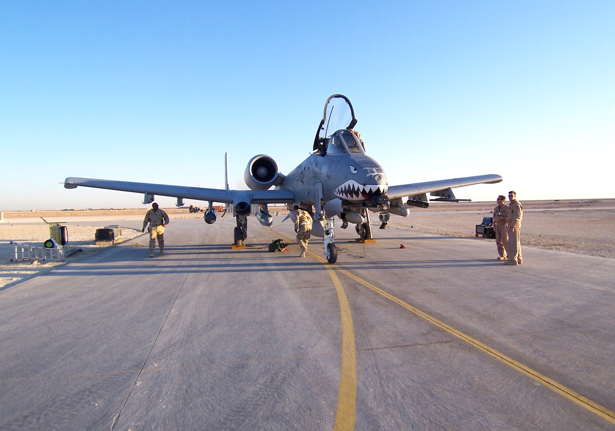 Airmen from the 438th Air Expeditionary Group retrieve one of the newly assigned A-10 Thunderbolt II aircraft Jan. 17 at Al Asad Air Base, Iraq. The unit's mission is to provide close-air support for coalition forces in the province. (U.S. Air Force photo/Chief Master Sgt. Bryce Maxson)