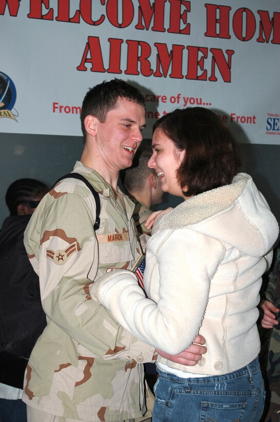 Airman First Class Jonathan Marion, 374th Civil Engineer Squadron, is welcomed home by friends and family at the Yokota Air Base Passenger Terminal after returning from deployment.