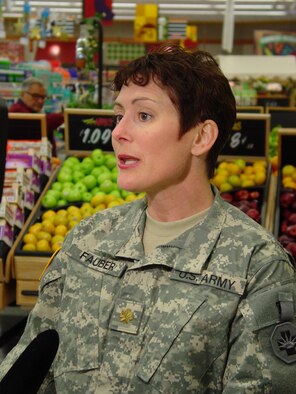 Maj. Karen Fauber, the DeCA dietitian, is shown here at the Andrews Air Force Base Md. Commissary during the filming of a segment for the Pentagon Channel. The segment, scheduled for release in the near future, will offer advice on how to shop for foods that will help consumers stick to their New Year's resolutions to lose weight.