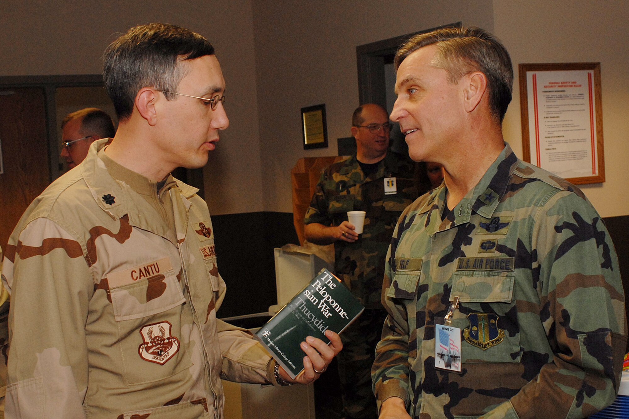 Lt. Col. Christopher Cantu, 463rd Operations Support Squadron director of operations, talks with Brig. Gen. Kip Self, 314th Airlift Wing commander, while waiting for his departure from Little Rock Air Force Base Jan. 21. (Photo by Airman 1st Class Nathan Allen)
