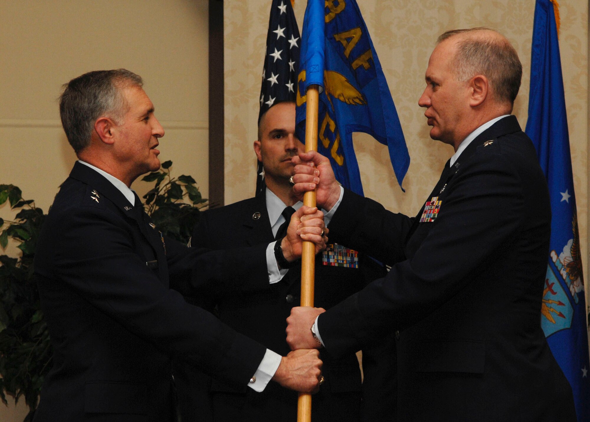 Maj. Gen. Ron Ladnier assumes command of the TACC, as presented by Maj. Gen. James Hawkins who presided during the ceremony.  General Hawkins is the 18th Air Force commander.  (U.S. Air Force photo by Airman 1st Class Megan Gilliand) 