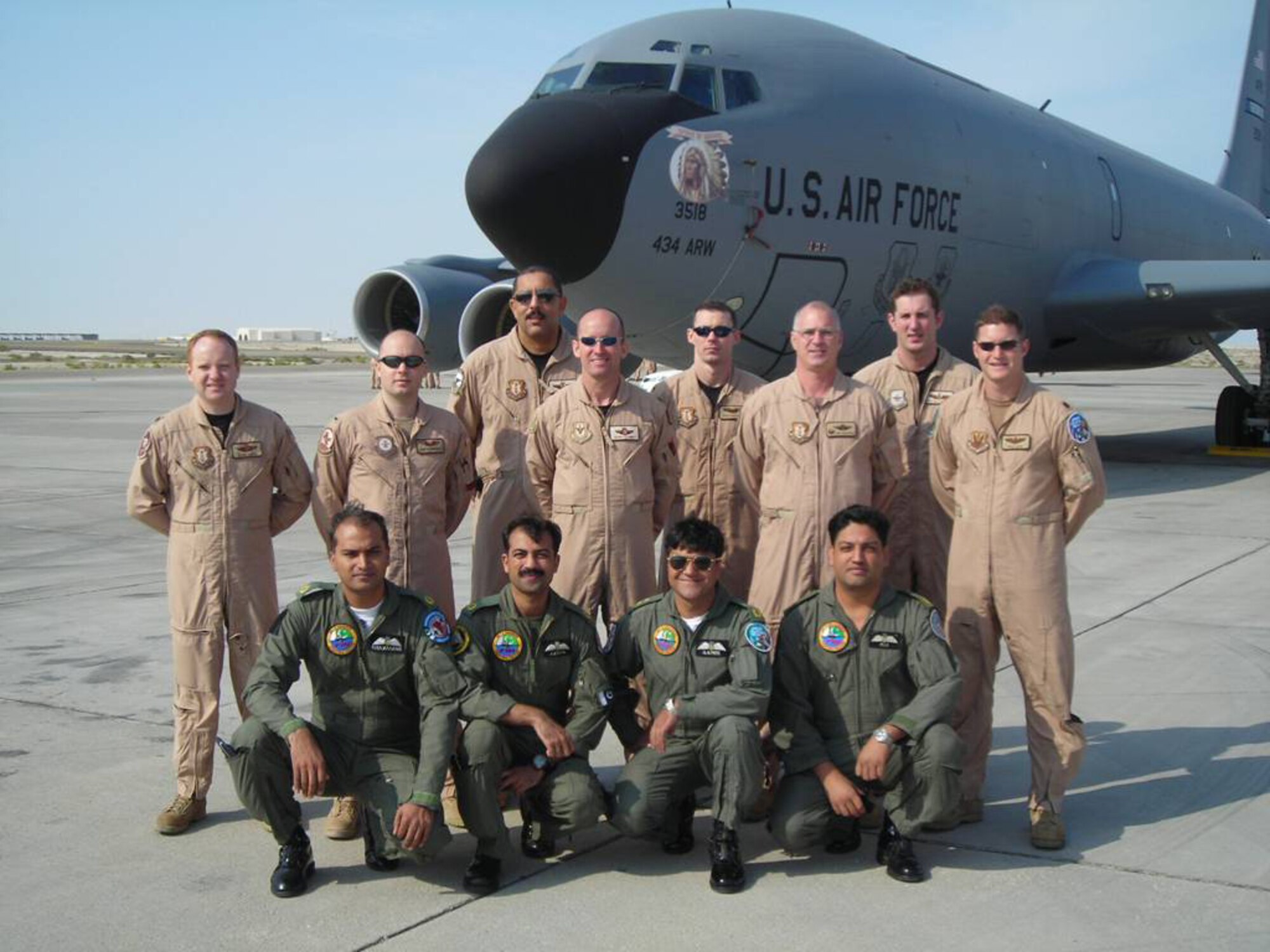 GRISSOM AIR RESERVE BASE, Ind. -- Aircrew members from Grissom ARB stand with members of the Pakistan air force, who participated in a historic refueling first during Exercise Iron Falcon 0701. Grissom crew members peformed the very first aerial refueling mission with the Pakistan air force. Grissom's members are standing. From the left they are Lt. Col. Kevin  Hayes, 1st Lt. Rob Hastings, Master Sgt. Kim Orange, Lt. Col. Gerry Conway, 1st Lt. Rick Hastings, Lt. Col. James Corcoran, Master Sgt. Mike Morgan and Maj. Chad Silva. (U.S. Air Force Photo)