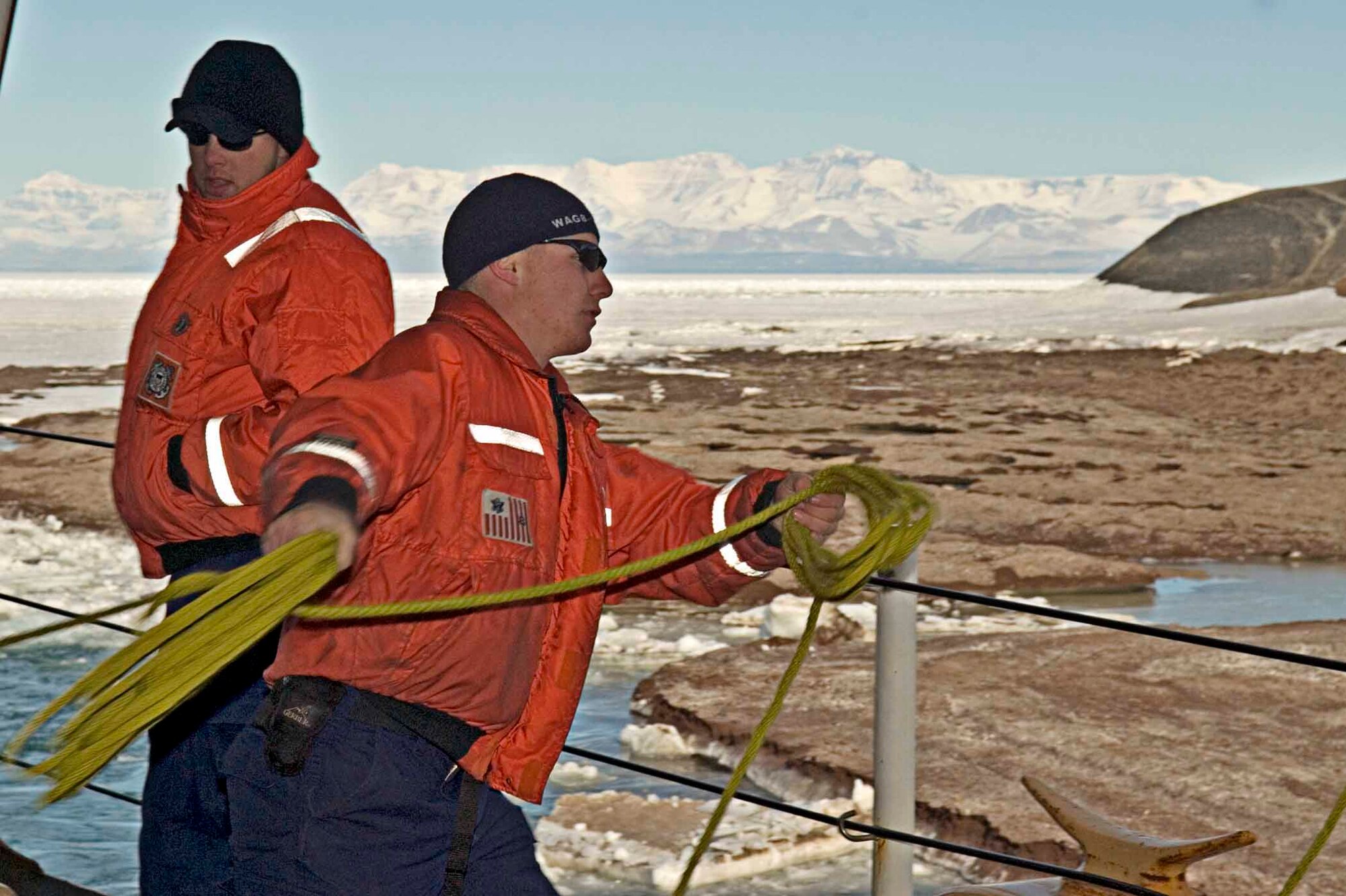 MCMURDO, ANTARCTICA (Jan. 10, 2007)- Seaman Sam Snippa throws over the heaving line to put a line on the "ice pier" at McMurdo Station.  The Coast Guard Cutter Polar Sea made a port call to McMurdo to refuel and resupply needed items.  The Polar Sea is on a six-month deployment as a part of the Air Force-led Joint Task Force Support Forces Antarctica, Operation Deep Freeze 2007, clearing a navigable channel for supply ships to get needed equipment and goods to scientists working in McMurdo. (US Coast Guard Photo by Petty Officer Kevin J. Neff)