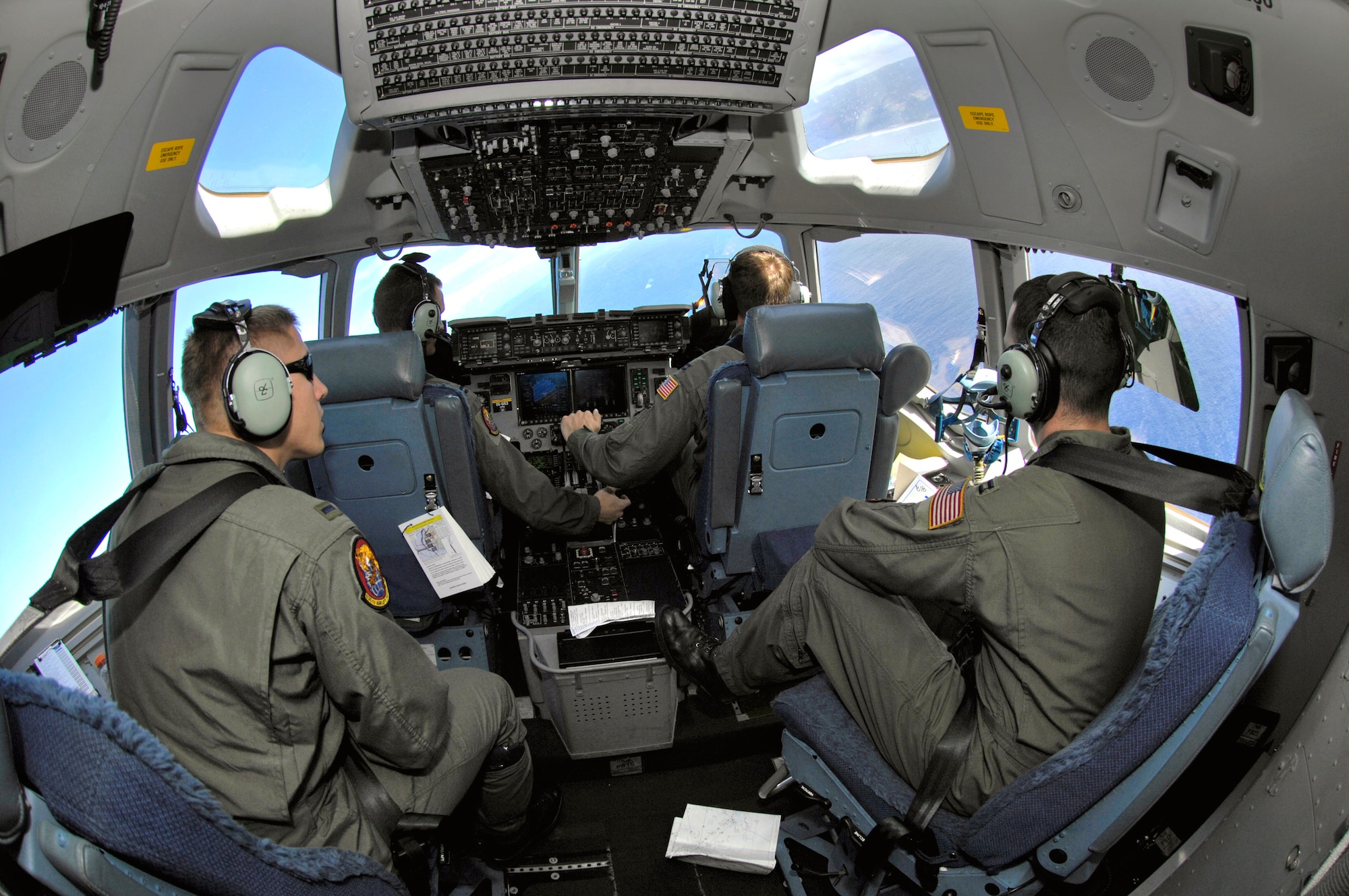 Pilots from the 535th Airlift Squadron from Hickam Air Force Base, Hawaii, fly their C-17 Globemaster III during a local training mission Jan. 19, 2007 over the Hawaiian Islands. In February 2006, Hickam AFB received its first C-17. (U.S. Air Force photo/ Tech. Sgt. Shane A. Cuomo) 
