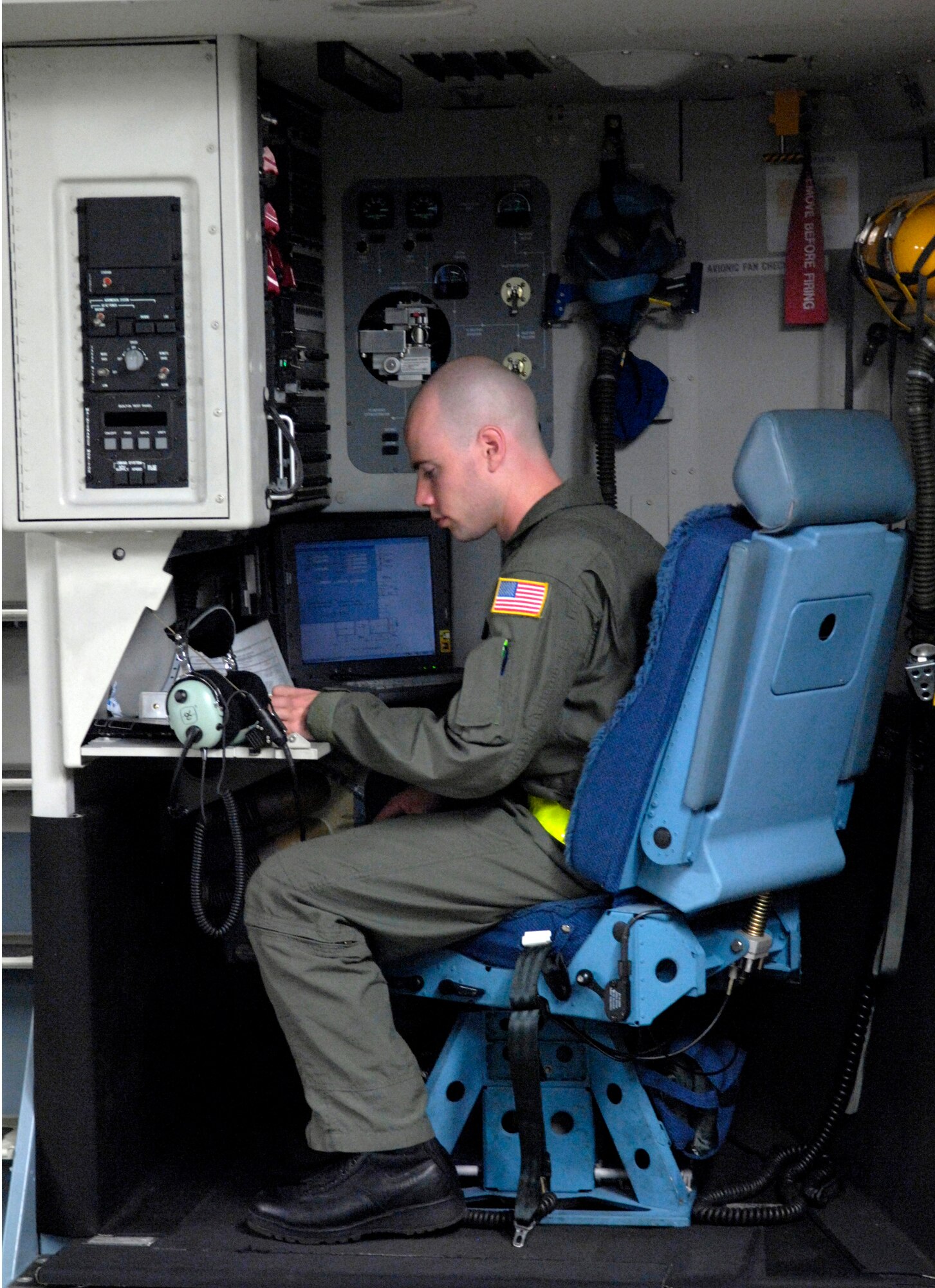 Senior Airman Nick Kaslin goes over a checklist before departing for a local training mission Jan. 19 from Hickam Air Force Base, Hawaii. Airman Kaslin is a loadmaster with the 535th Airlift Squadron. The C-17 is capable of rapid strategic delivery of troops and all types of cargo to main operating bases or directly to forward bases in the deployment area. (U.S. Air Force photo/Tech. Sgt. Shane A. Cuomo) 
