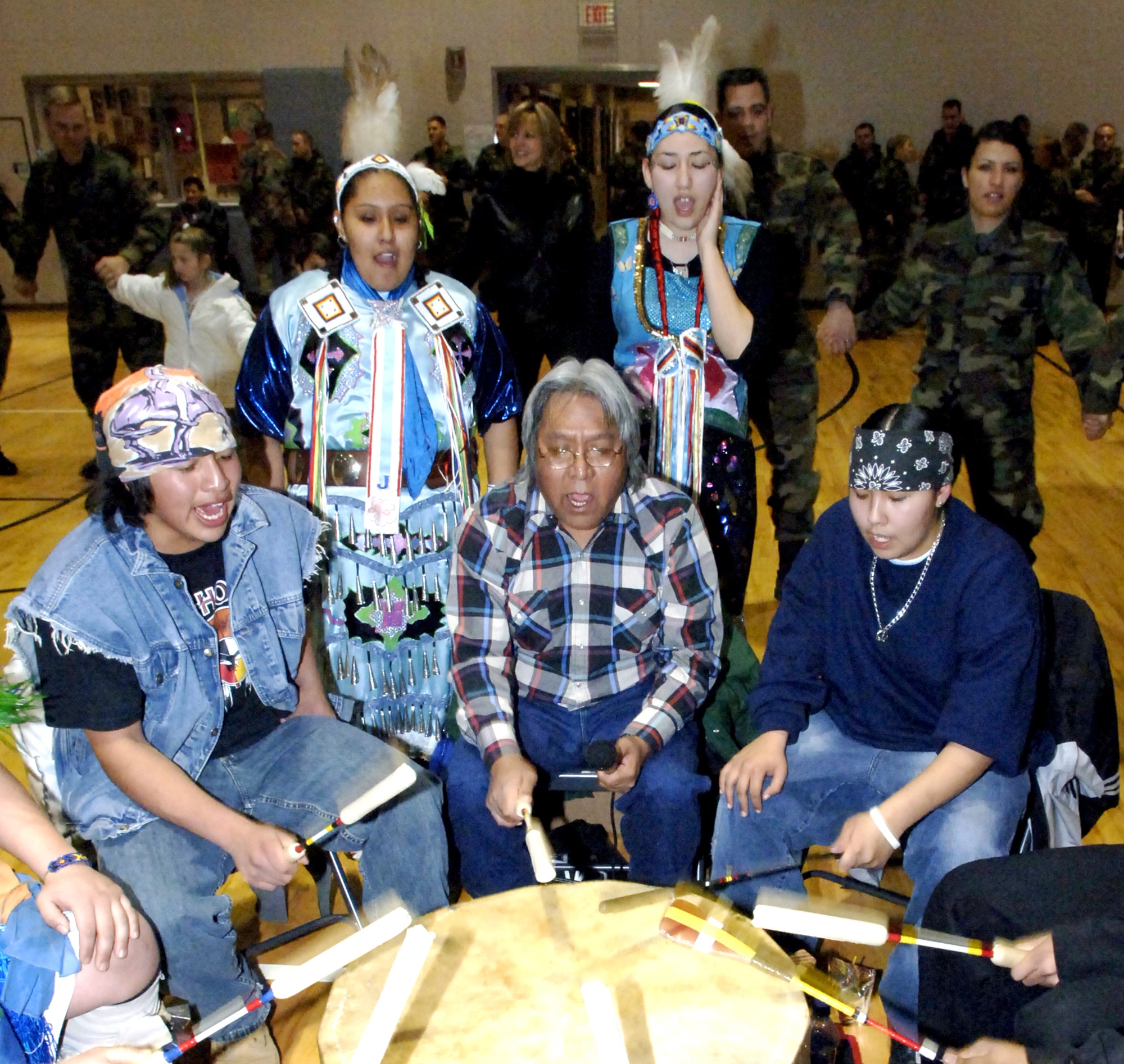 MOUNTAIN HOME AIR FORCE BASE, Idaho – Members of the Shoshone-Paiute Battle House Drum Group perform during the Round Dance at the annual pow-wow celebration Jan. 19 at the Youth Center. More than 25 tribal members visited the base to perform a series of traditional songs and dances to share their culture and traditions with the base community. Air Force photo by Master Sgt. David Wheeler