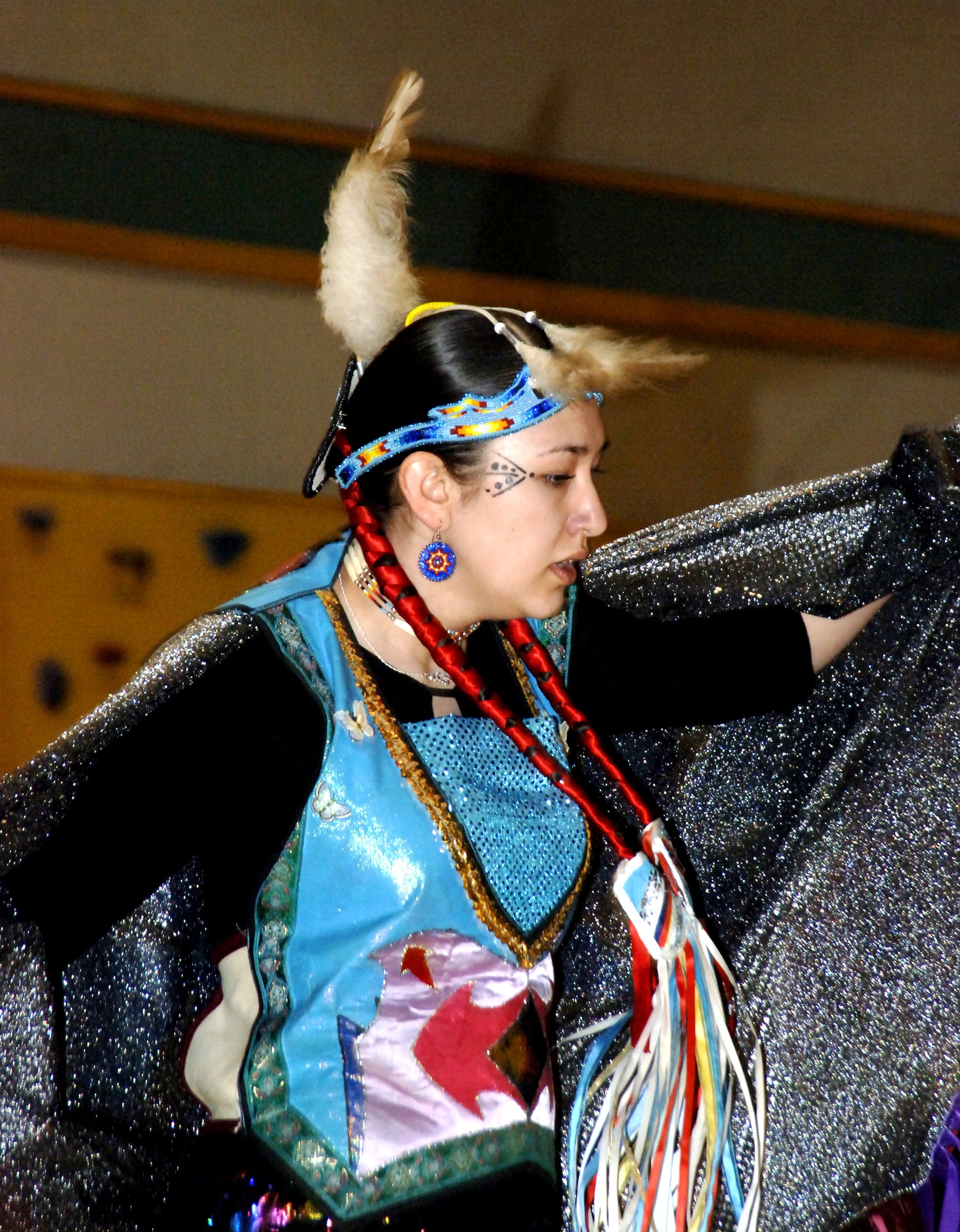 MOUNTAIN HOME AIR FORCE BASE, Idaho – Oleta Goodnight from the Shoshone-Paiute Tribe Dance Group performs a traditional Fancy Dance at the annual pow-wow celebration Jan. 19 at the Youth Center. This contemporary, free style of dance features soaring and swooping moves with men representing birds in flight and women representing graceful butterflies. More than 25 tribal members visited the base to perform this and other traditional songs and dances to share their culture and traditions with the base community. Air Force photo by Master Sgt. David Wheeler