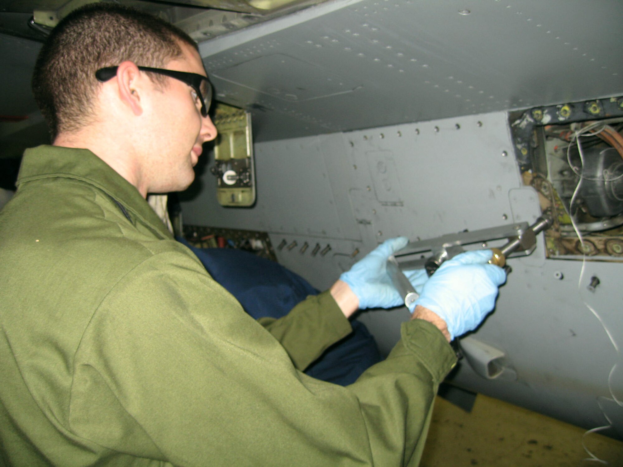 Crew chief, Staff Sgt. Jon Wilkey, makes one last fix prior to a Quality Assurance Inspection. (USAF photo by Staff Sgt. Christi Wright)