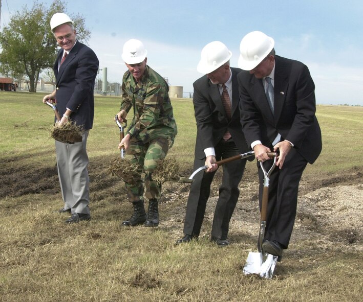 (Photo by Frank McIntyre) Col Mike Callan, 71st Flying Training Wing commander, is joined by (from the left) Phil Tomlinson, Oklahoma Secretary of Transportation; Ernie Currier, mayor of Enid; and Mike Cooper, Vance AFB Development Authority, at the groundbreaking ceremony for the Gott Road extension. The $1.18 million project will extend  the Vance AFB main entrance a half mile north. The extension is the first step of the force protection efforts to increase standoff space between public roads and the base’s northern perimeter.