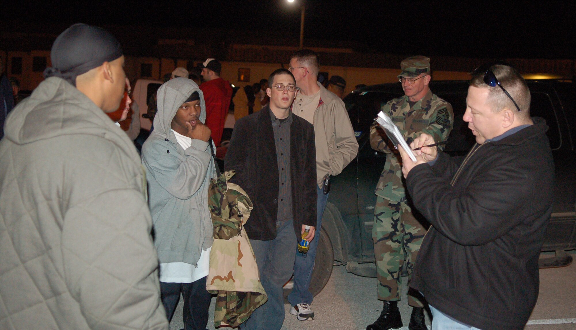 LAUGHLIN AIR FORCE BASE, Texas -- Capt. Ken Hall, troop commander (right), takes a count of members of the 47th Flying Training Wing as they prepare to deploy to various bases in Southwest Asia around midnight Jan. 21.  (U.S. Air Force photo by Staff Sgt. Austin May)