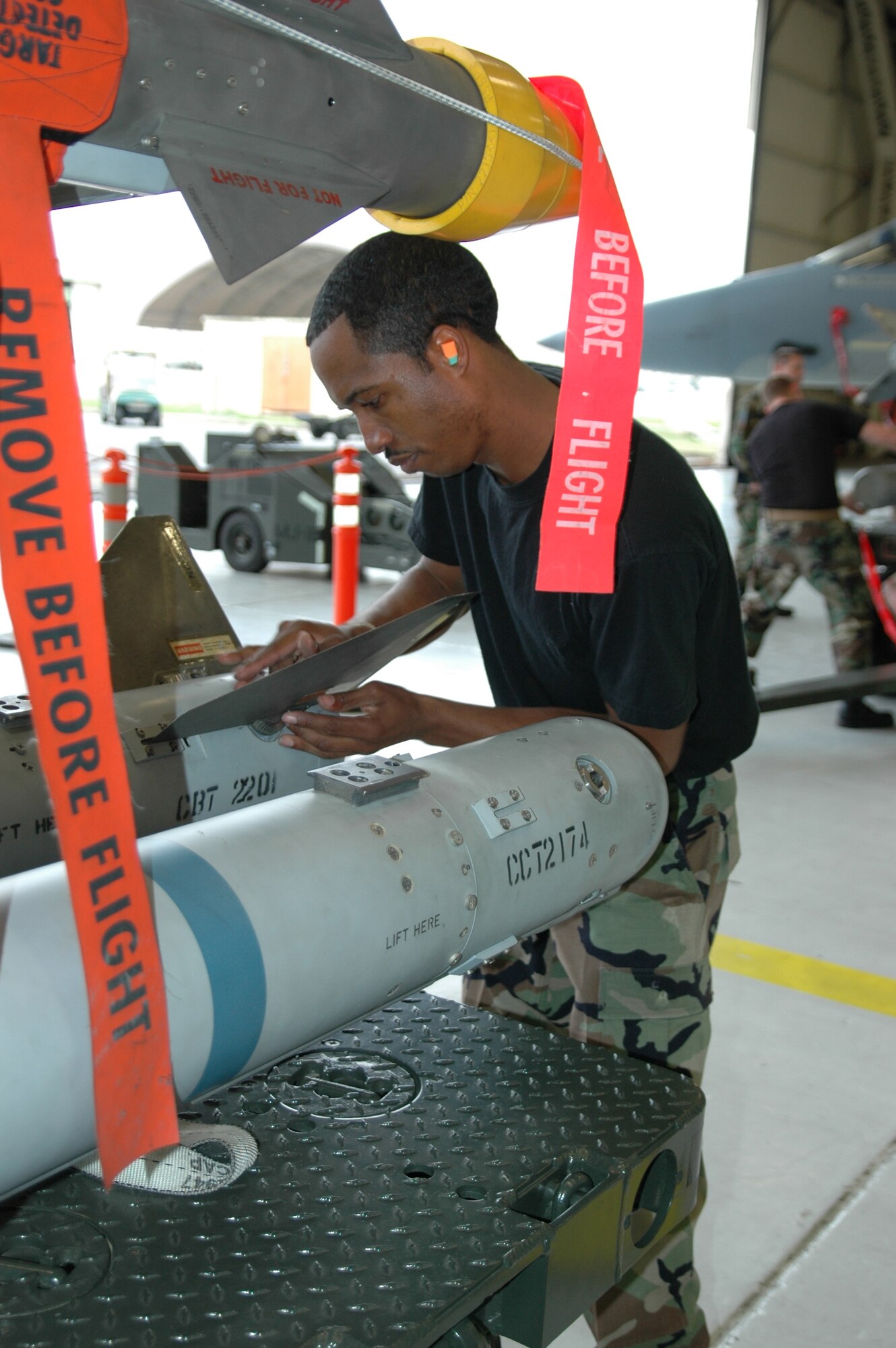 EGLIN AIR FORCE BASE, Fla. – Staff Sgt. Keith Bowie, 58th Aircraft Maintenance Unit load crew member installs fins on an AIM-120 AMRAM in preparation to load the missile onto an F-15C Eagle during the 33d Fighter Wing’s annual load crew competition Jan. 19.  Quarterly AMU load competition winners competed in the annual competition and consisted of three load teams from the 58th AMU and one team from the 60th AMU. (Air Force Photo/by Capt. Brooke Brander)