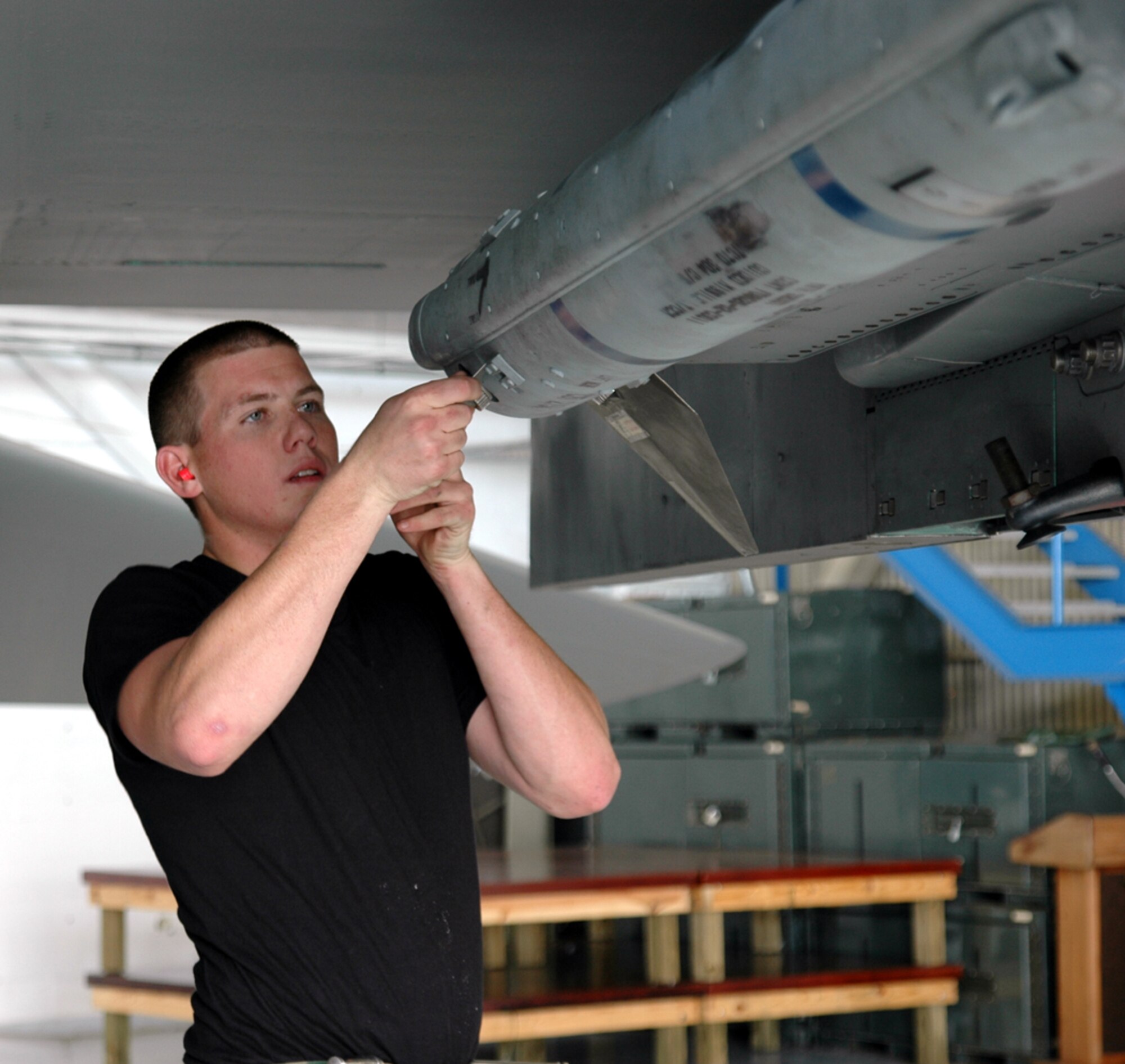EGLIN AIR FORCE BASE, Fla. – Airman 1st Class Nicholas Turner, 58th Aircraft Maintenance Unit load crew member, installs wings and fins on an AIM-120 AMRAM missile during the 4th quarter weapons load crew competition in the 33d Maintenance Operations Squadron hangar Jan. 12.  The AIM-120 is a new generation air-to-air missile and has all-weather, beyond-visual-range capabilities.  The 58th AMU won the 4th quarter load competition for the 33d Fighter Wing. (Air Force Photo/by Staff Sgt. Phillip O. Butterfield)