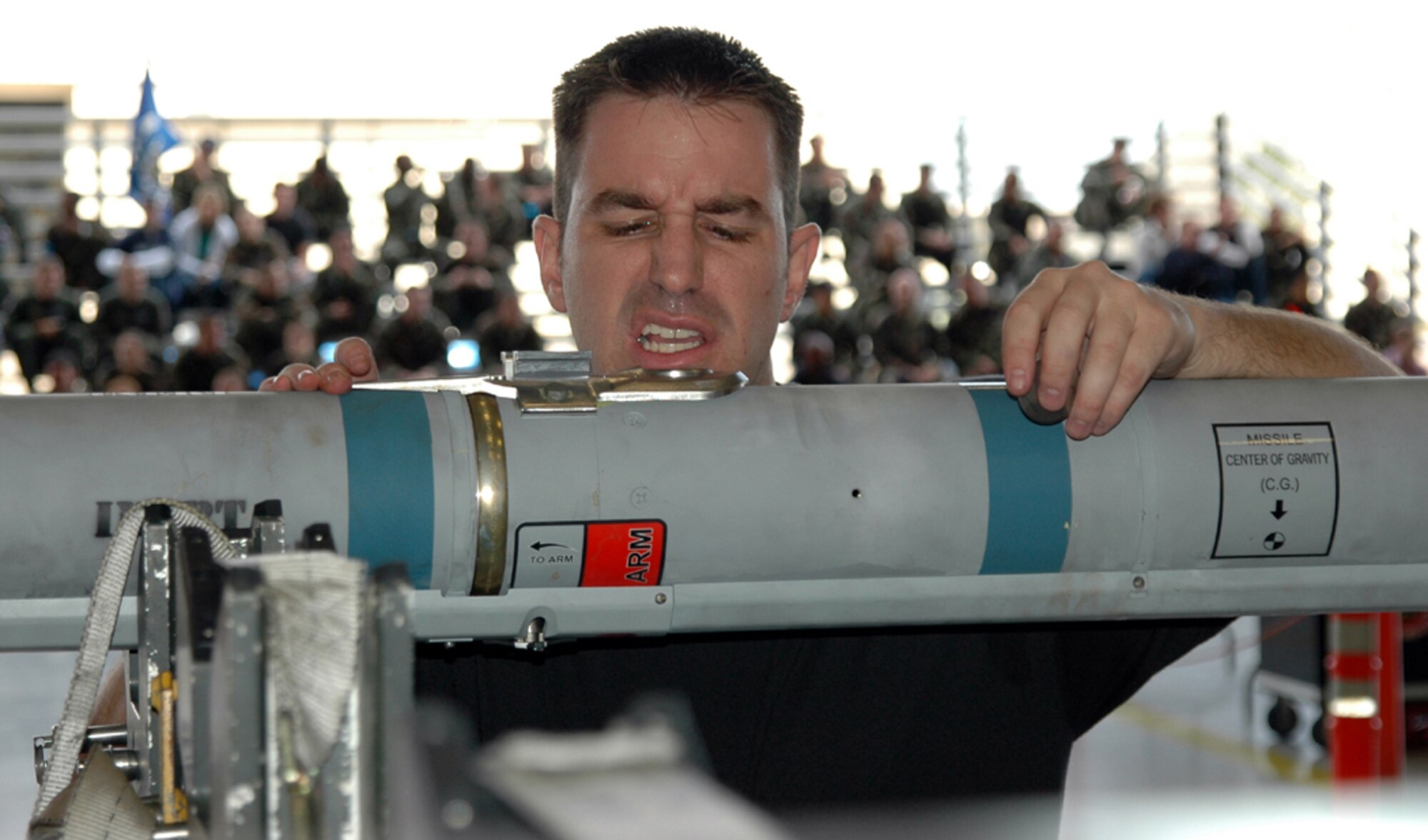 EGLIN AIR FORCE BASE, Fla. – Staff Sgt. Emory Purdy, 58th Aircraft Maintenance Unit load crew chief, inspects AIM-9X umbilical for foreign object damage during the 4th quarter weapons load crew competition in the 33d Maintenance Operations Squadron hangar Jan. 12. The load competition is a contest to determine which AMU has the best weapons load team. (Air Force Photo/by Staff Sgt. Phillip O. Butterfield)