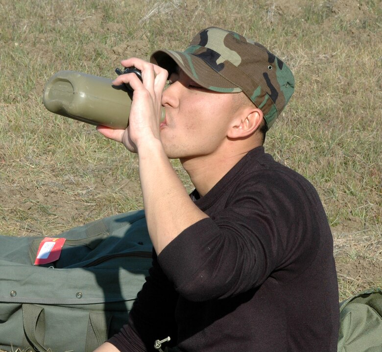 Staff Sgt. Vi Tu, 60th Communications Squadron, takes a much needed water break during the field exercise portion of the Combat Skills Training course. The course stresses combat survival skills, including the importance of staying properly hydrated, during the all-day field training exercise. (U.S. Air Force photo by Staff Sgt Candy Knight)