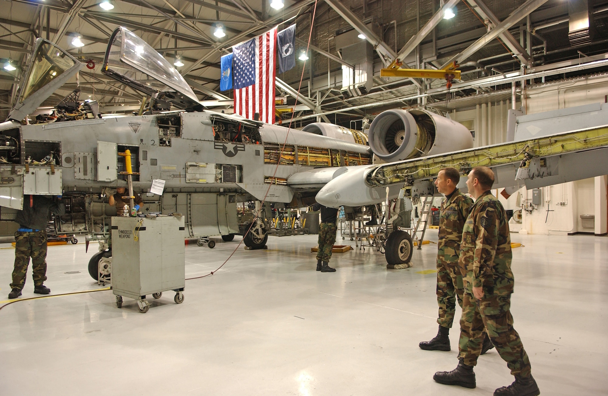 EIELSON AIR FORCE BASE, Alaska- Chief Master Sgt. Anthony Bishop, Pacific Air Forces command chief, speaks to an Airman inside of the Phase Dock in a maintenance hangar during his visit to Eielson Jan. 17 and 18.  (U.S. Air Force Photo by Senior Airman Anthony Nelson)  