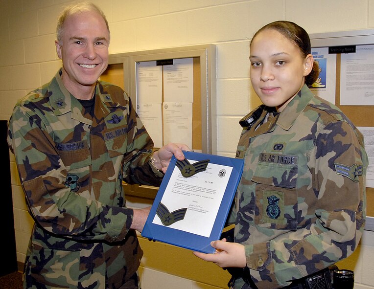 The sleeves on Airman 1st Class Savanna Wesley's BDU top will get heavier in the near future when she pins on senior airman. Brig. Gen. Richard Devereaux, left, 82nd Training Wing commander, notified Airman Wesley she was selected for early promotion under the Below-the-Zone program. (U.S. Air Force photo/Harry Tonemah)