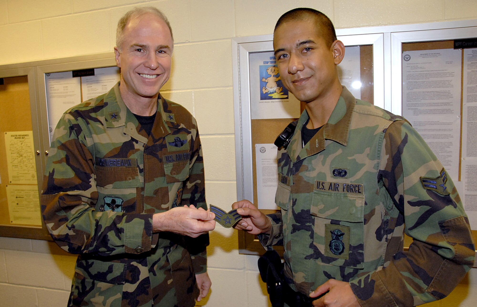 Airman 1st Class Billy De Leon of the 82nd Security Forces Squadron is notified Jan. 19 by Brig. Gen. Richard Devereaux, commander of the 82nd Training Wing, of his selection for promotion to senior airman under the Below-the-Zone program. (U.S. Air Force photo/Harry Tonemah)