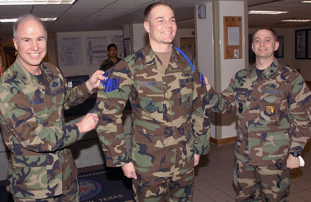 82nd Training Wing Commander Brig. Gen. Richard Devereaux and Lt. Col. Glenn Roberts, commander of the 360th Training Squadron, puts the appropriate rank on then-Staff Sgt. Norman Hicks. Sergeant Hicks was notified Jan. 19 that he was selected for promotion under the Stripes for Exceptional Performers, or STEP, program. (U.S. Air Force photo/Harry Tonemah)
