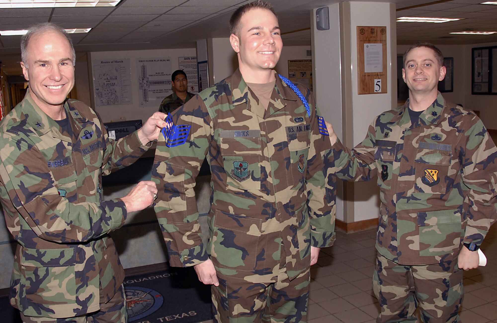 82nd Training Wing Commander Brig. Gen. Richard Devereaux and Lt. Col. Glenn Roberts, commander of the 360th Training Squadron, puts the appropriate rank on then-Staff Sgt. Norman Hicks. Sergeant Hicks was notified Jan. 19 that he was selected for promotion under the Stripes for Exceptional Performers, or STEP, program. (U.S. Air Force photo/Harry Tonemah)