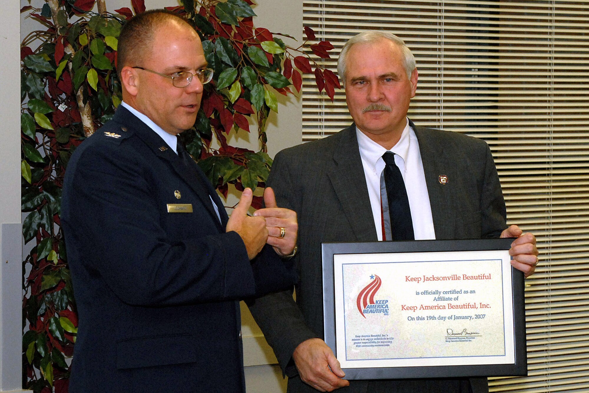 Col. Scott Lockard, 314th Mission Support Group commander, and Jacksonville Mayor Tommy Swaim speak about the shared role between Little Rock Air Force Base and Jacksonville in the Keep Jacksonville Beautiful initiative. The base has been awarded multiple times for its recycling or beautification projects and the new Keep Jacksonville Beautiful Committee will strengthen the relationship between the base and city. (Photo by Airman 1st Class Nathan Allen)