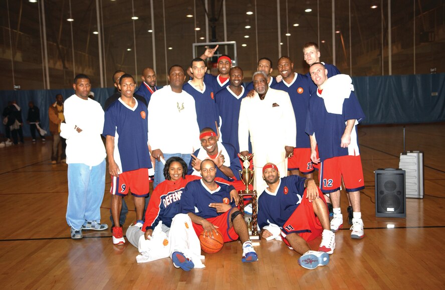 OSAN AIR BASE, Republic of Korea --  The Osan Defenders show off the hardware they received after Wednesday’s night victory during the finals of the 2006 Pacific Air Forces-wide preseason tournament. (U.S. Air Force photo by Airman Ruthann Holcomb)