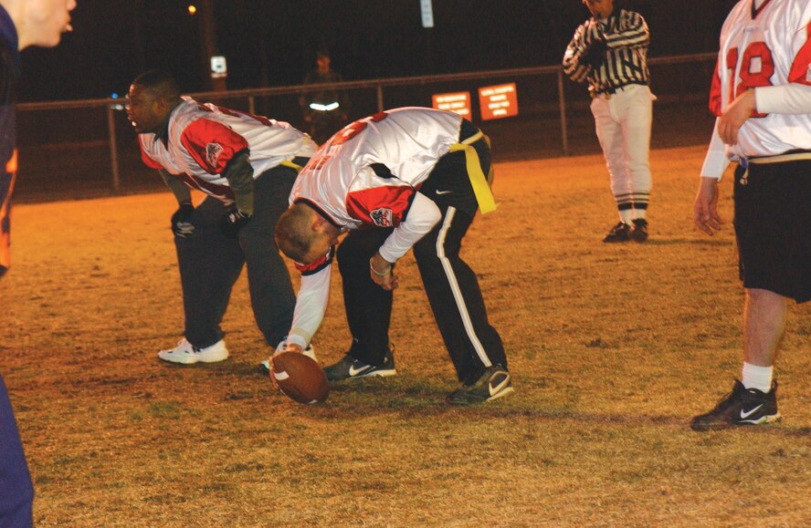 OSAN AIR BASE, Republic of Korea --  Staff Sgt. Eddie Evans, 5th Reconnaissance Squadron, prepares to hike the ball into play during an intramural flag football game Dec. 29. (U.S. Air Force photo by Senior Airman Eunique Stevens)