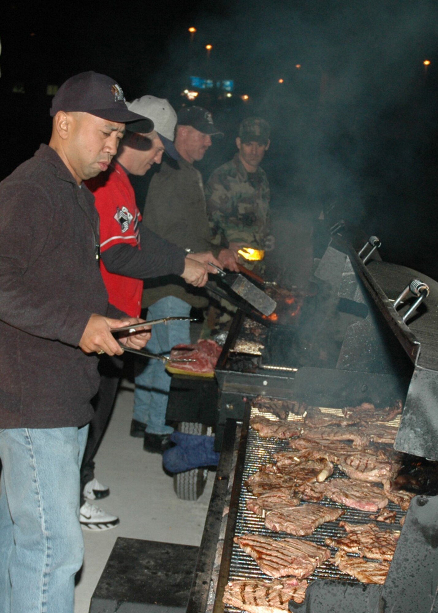 OSAN AIR BASE, Republic of Korea --  The Osan 5/6 Club hosted the first Team Osan 'Enlisted Only' Combat Dining-In Nov. 30 at the traffic management office warehouse in Bldg 635. Approximately 12 people were responsible for preparing, cooking and serving more than 600 pieces of steak and chicken. (U.S. Air Force photo by Tech. Sgt. Michael O'Connor)