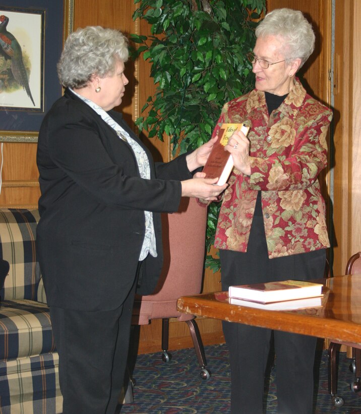 Mrs. Jackie Driver presents the book "Tales of Texoma" to Ms. Kathleen Roseboom of the 82nd Services division.  The book will become part of the Sheppard Library collection. (Photo by SSgt Tonnette Thompson)