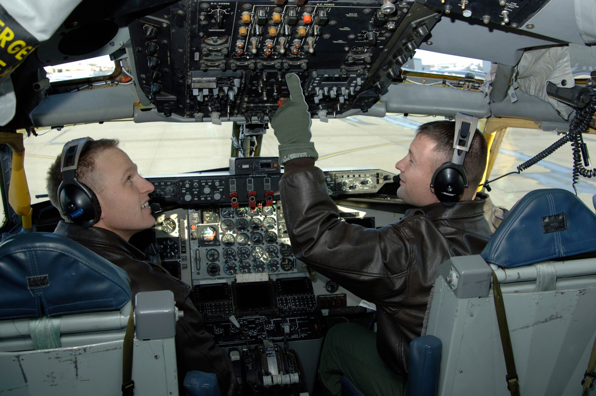 Maj. Max Bremer and Capt. Aaron Torczynski, 22nd Operations Group pilots, perform a pre-flight check on a KC-135 Wednesday. During a pre-flight check, aircrew members test aircraft equipment to ensure it is functioning properly. (Photo by Senior Airman Jamie Train, 22nd Communications Squadron)