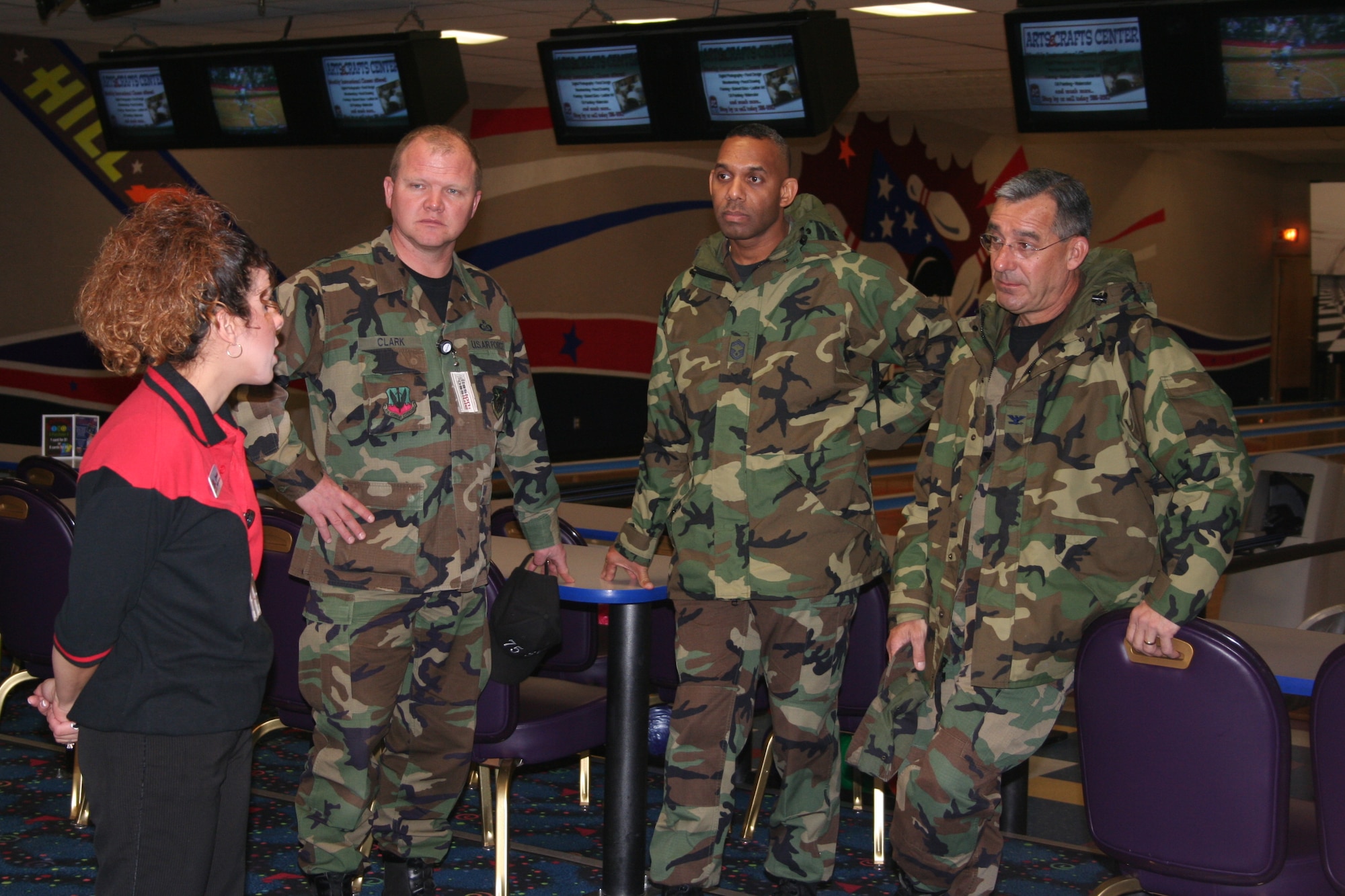(Left to right) Danielle Garcia, bowling center employee, gives a tour of the Hill Bowling Center to Senior Master Sgt. Wade Clark, 75th Services Division superintendent, Chief Master Sgt. Venton Lamont, AF LeMay team member  and Col. Frederic Ryder, AF LeMay team chief, during a visit last week to evaluate the entire services division as part of the Gen. Curtis E. LeMay competition. This competition is used to select the best services program in the Air Force. 