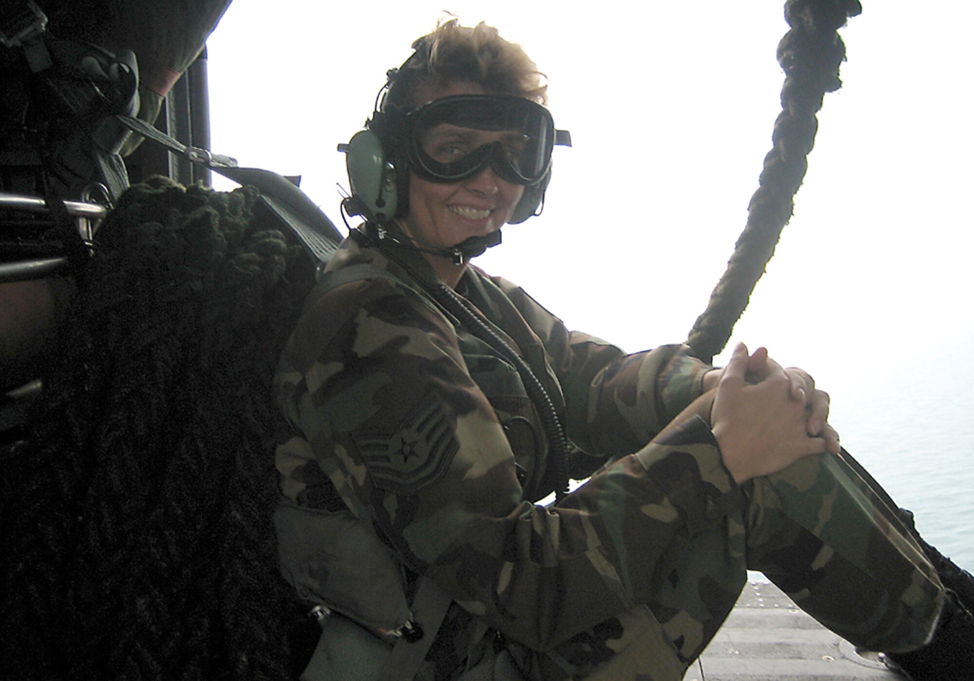 Tech. Sgt. Kimberly Kelly, a recruiter for the 333rd Recruiting Squadron, sits back and enjoys her first incentive ride in an HH-60G Jolly Green helicopter Dec. 13 at Patrick Air Force Base, Fla. (U.S. Air Force photo by Tech. Sgt. Christopher Simons)