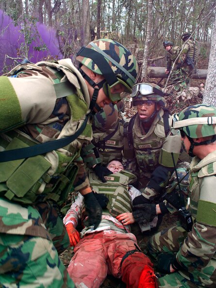 Members of the 823rd Security Forces Squadron provide first aid to a mock casualty during a combat medical skills excercise at Moody Air Force Base, Ga., Jan. 19. (U.S. Air Force photo by Senior Airman Walter Velazquez)