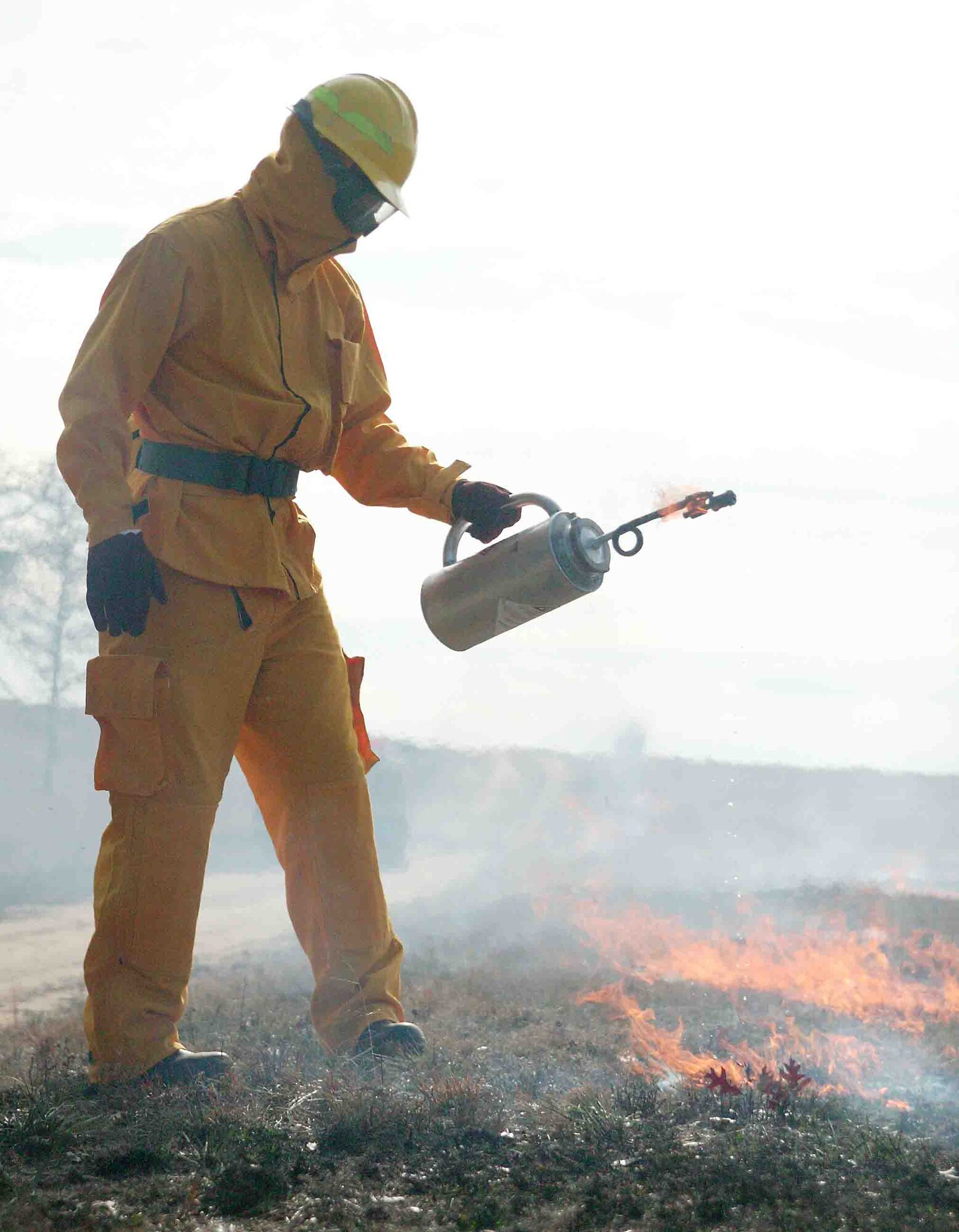 A 20th Civil Engineer Squadron firefighter ignites patches that were left behind after the prescribed fire Jan. 12 on the Poinsett Electronic Combat Range.  (U.S. Air Force photo/Senior Airman John Gordinier)