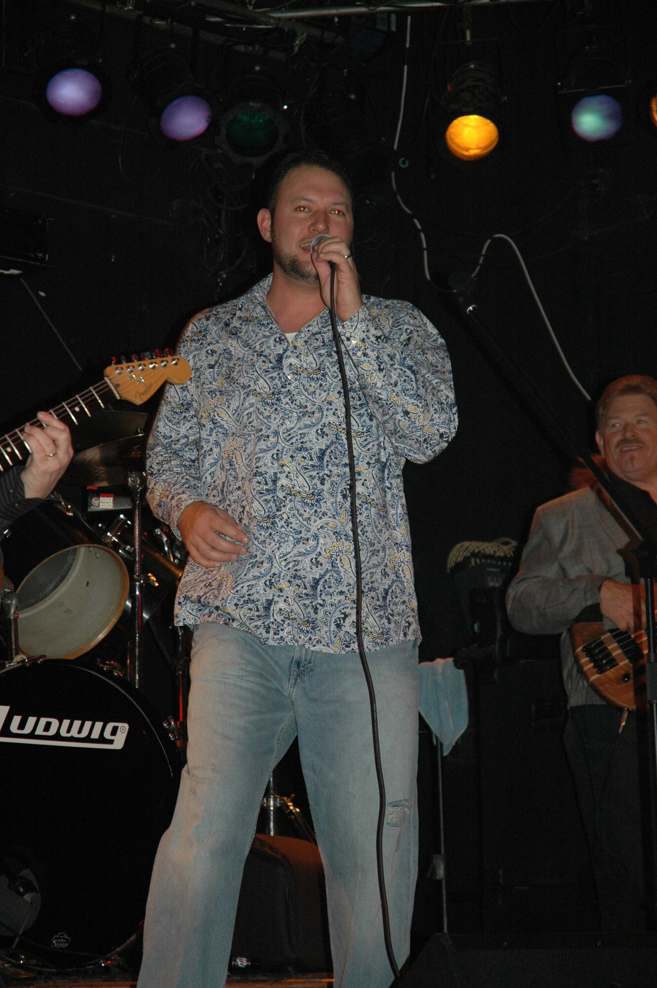 Staff Sergeant Jayson Johnston, a reservist with the 315th Aircraft Maintenance Squadron, Charleston AFB, S.C., performs with his band Whiskey and Perfume at the Windjammer, Isle of Palms, S.C., Jan. 19. (Photo by Airman 1st Class Dani Pacheco, USAFR)
