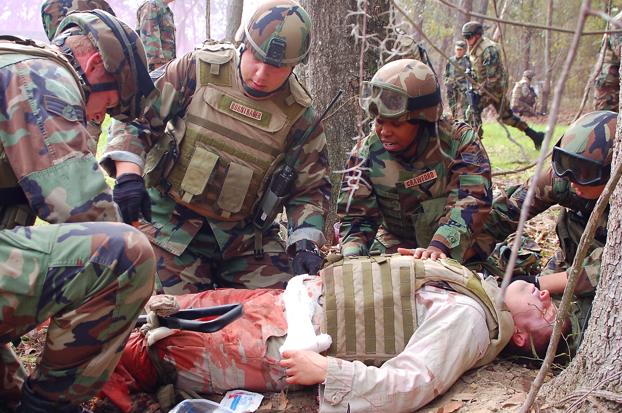 Members of the 823rd Security Forces Squadron provide first aid to a mock casualty during a combat medical skills excercise Jan 19. (US Air Force photo by Tech. Sgt. Parker Gyokeres) 
