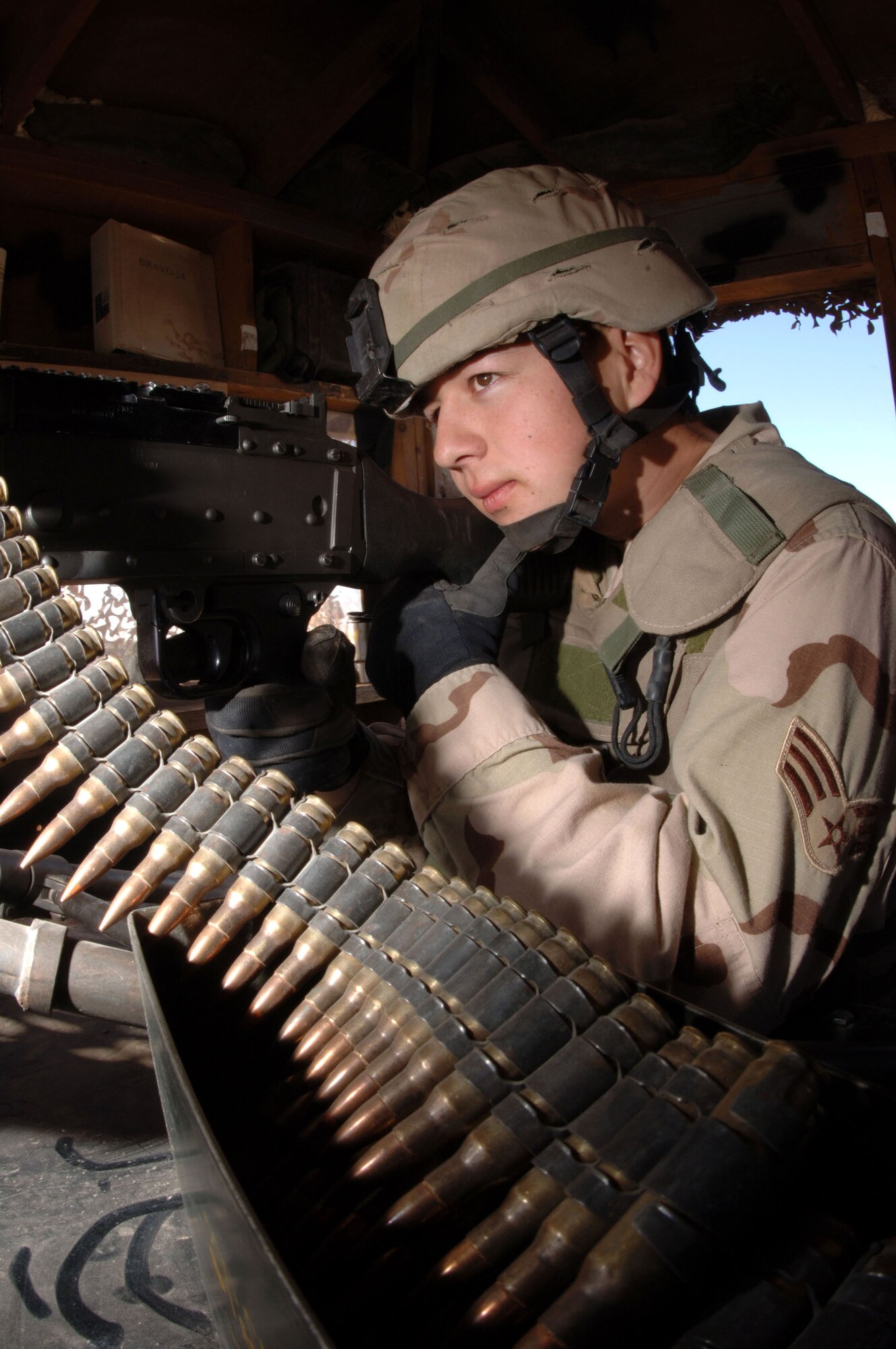 Senior Airman Richard Rodriguez aims a machine gun toward an entry control point Jan. 24 at Kirkuk Regional Air Base, Iraq. Airman Rodriguez is a 506th Expeditionary Security Forces Squadron perimeter guard who is deployed from the 5th SFS at Minot Air Force Base, N.D. (U.S. Air Force photo/Senior Airman Bradley A. Lail)
