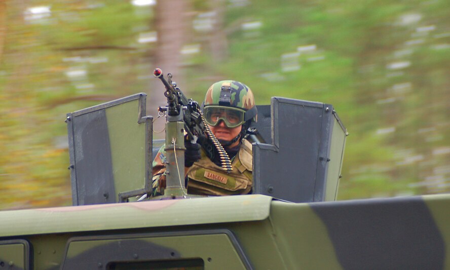 Airman 1st Class Kurtis Sanchez provides suppressive fire from a turret mounted M249 machine gun during a combat medical skills excercise held Jan. 19 at Moody Air Force Base, Ga. (U.S. Air Force photo by Tech. Sgt. Parker Gyokeres)