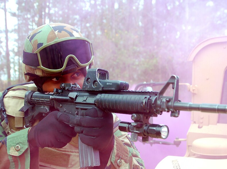 Senior Airman David Santee, 823rd Security Forces Squadron fire team member, guards the perimeter of a casualty collection point during a combat medical skills excercise held Jan. 19 at Moody Air Force Base, Ga. (U.S. Air Force photo by Tech. Sgt. Parker Gyokeres)