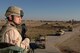 KIRKUK REGIONAL AIR BASE, IRAQ -- Senior Airman Richard Rodriguez, 506th Expeditionary Security Forces Squadron, checks the perimeter for insurgents here Jan. 24 as coalition convoys return from a patrol. Airman Rodriguez is deployed here from the 5th Security Forces Squadron at Minot Air Force Base, N.D.(U.S. Air Force photo by Senior Airman Bradley A. Lail)