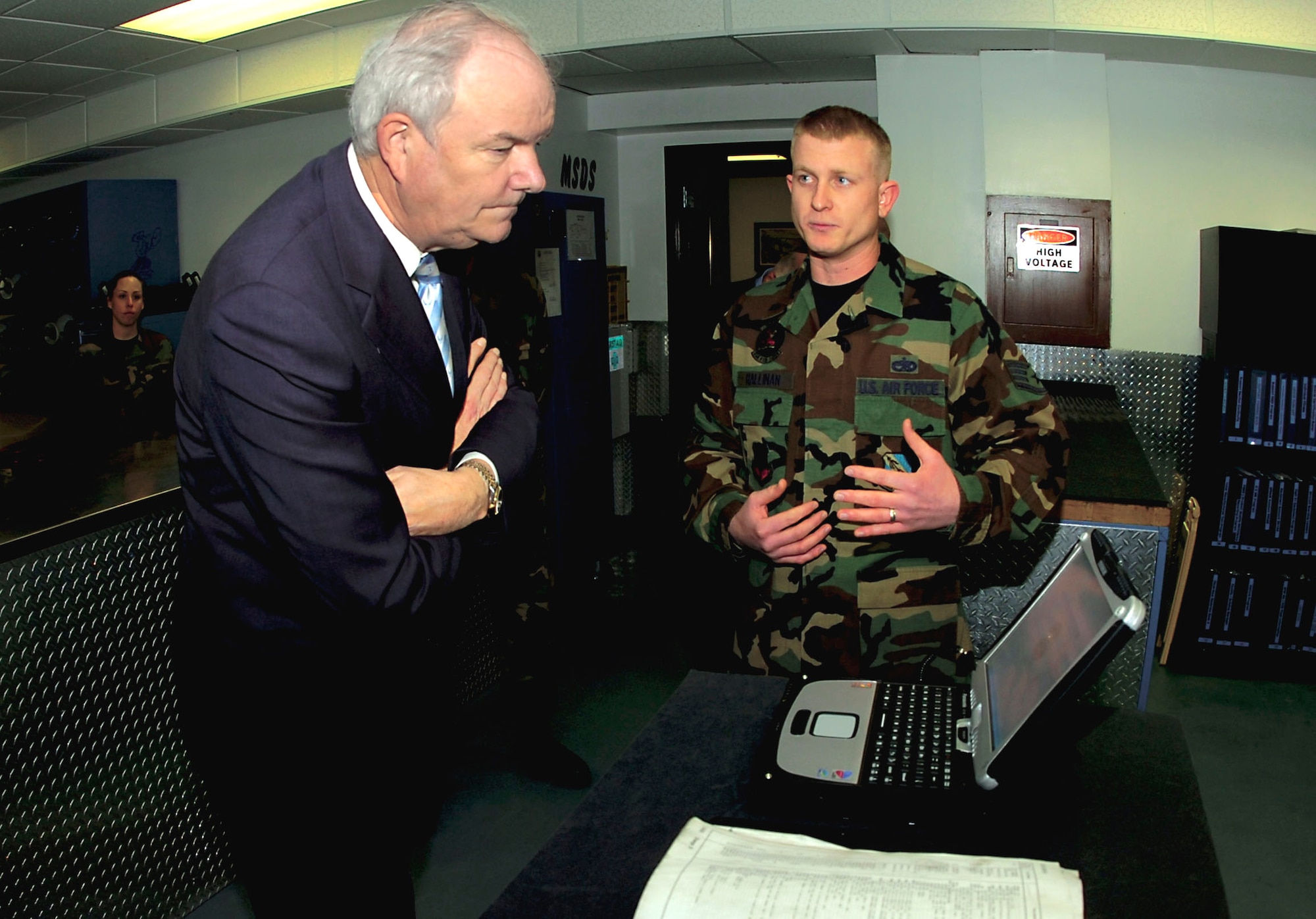 Staff Sgt. Ian Hallinan demonstrates the capabilities of the Interactive Electronic Technical Manuals system to Secretary of the Air Force Michael W. Wynne Jan. 19 during his visit to Seymour Johnson Air Force Base, N.C.  Sergeant Hallinan is with the 334th Aircraft Maintenance Unit.  (U.S. Air Force photo/Airman 1st Class Greg Biondo)