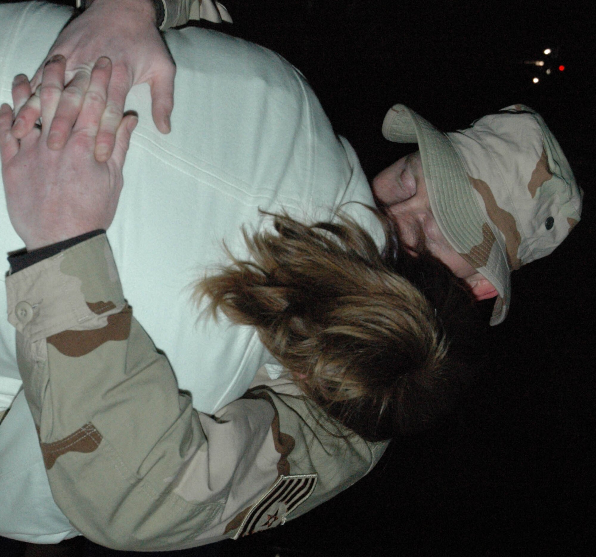 MCGUIRE AFB, N.J. -- Tech. Sgt. Kevin McGreevy gives wife, Janice, a goodbye hug before departing on a 120-deployment to Southwest Asia. The sergeant represents more than 35 Reserve members stationed at McGuire Air Force Base, N.J., currently serving lengthy deployments overseas. (U.S. Air Force photo/Master Sgt. Donna T. Jeffries)
