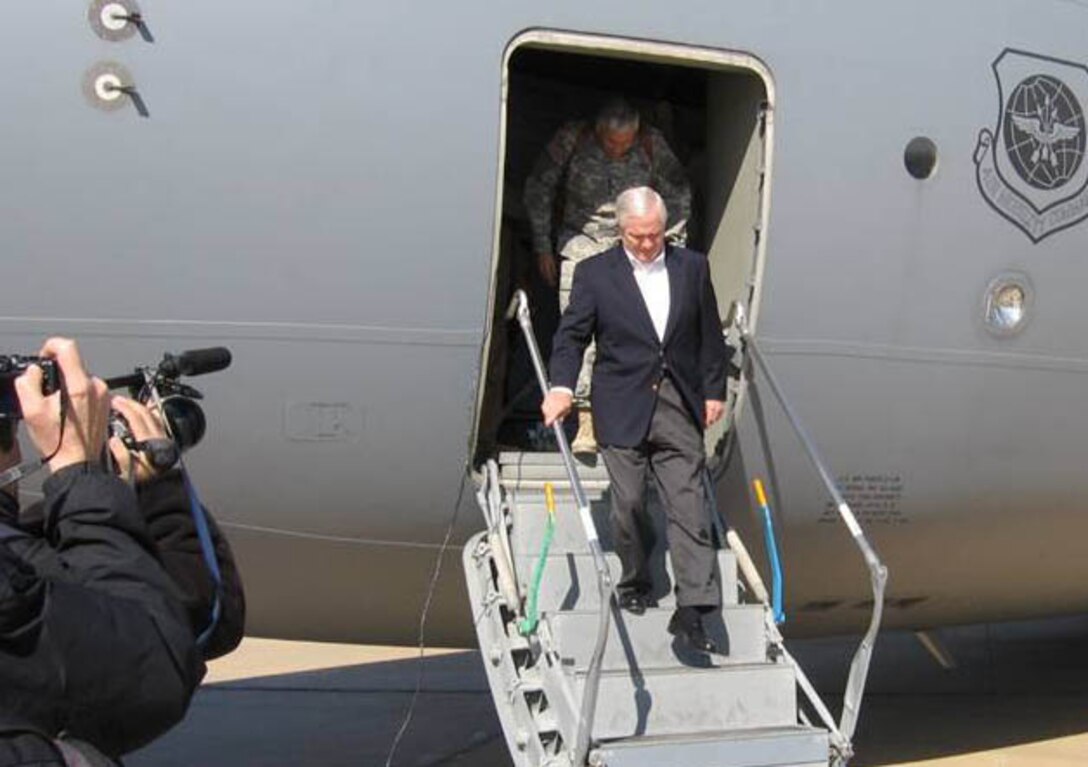 MCGUIRE AFB, NJ -- Robert Gates, Secretary of Defense exits the C-17 Globemaster III after returning from one of his first trips visiting U.S. troops deployed overseas. The mission was flown by Reserve aircrew from the 732nd Airlift Squadron, McGuire Air Force Base, N.J. (U.S. Air Force photo)