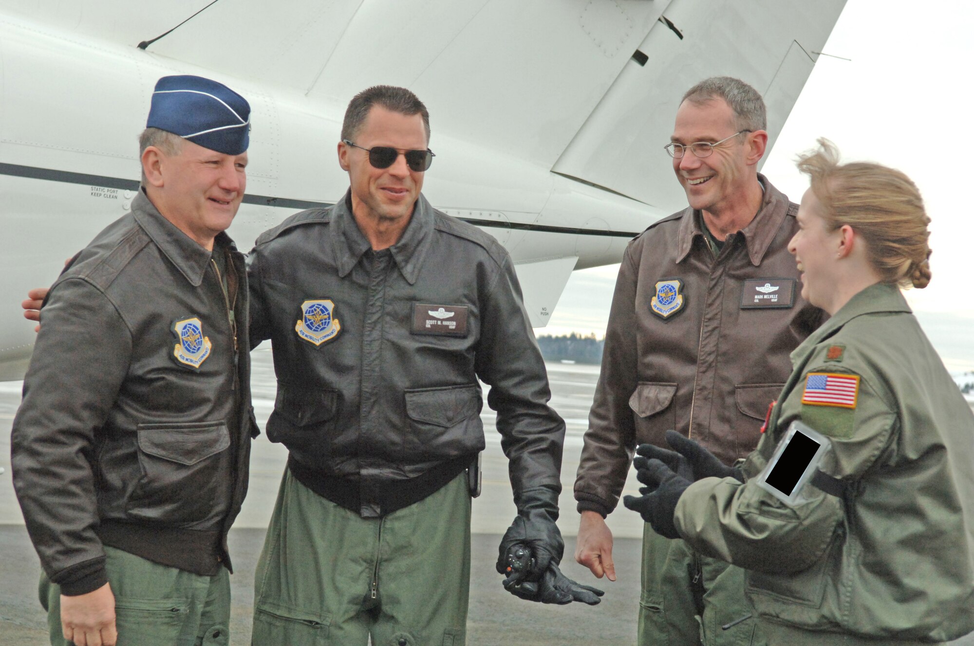 Brig. Gen. Frederick Roggero, Air Mobility Command deputy director of Air, Space and Information operations, is greeted by Col. Scott Hanson, 92nd Air Refueling Wing commander, Col. Mark Melville, 92nd Operations Group commander, and Maj. Leslie Picht, 92nd Wing Safety chief of safety, on the flightline Tuesday. The general is touring AMC bases for a command-wide flight safety briefing. (U.S. Air Force photo by Senior Airman Jessica Fuentez)

